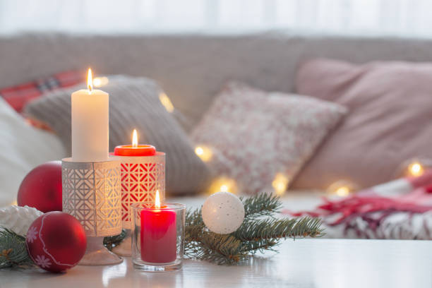 istock Christmas decora with candles and balls on white table indoor 1189535938
