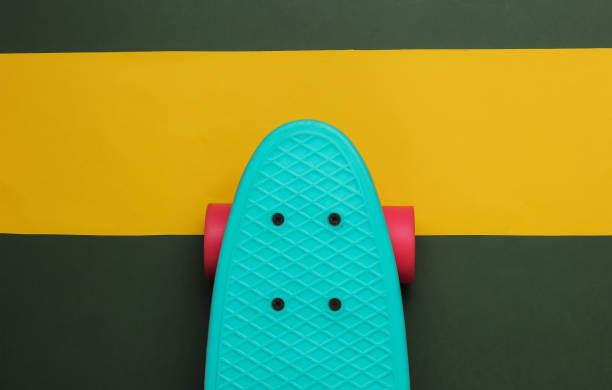 istock Cruiser board on colored paper background. Summer fun. Studio shot. Top view 1189536910