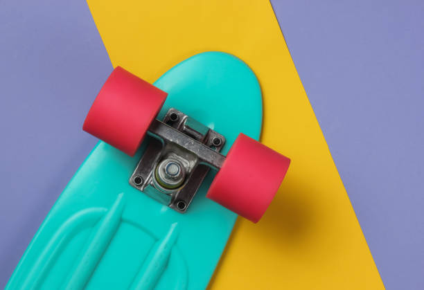 istock Cruiser board on colored paper background. Summer fun. Studio shot. Top view 1189536913