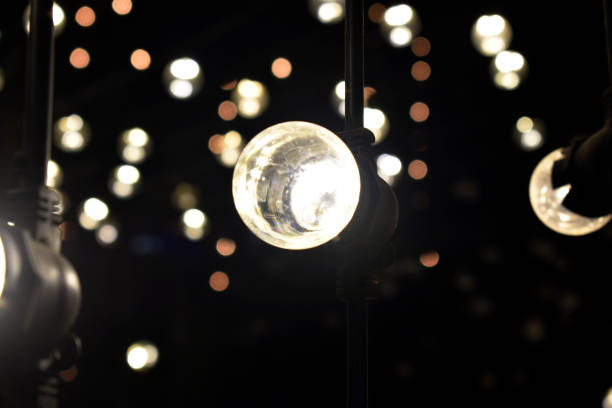 istock light from hanging lamp with bokeh blurred background in the dark night 1189537161
