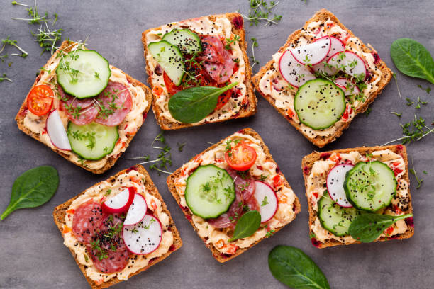 istock Sandwiches with cream cheese, vegetables and salami. 1189538529