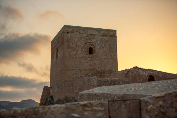 The ancient castle Part of the castle of Lorca, Murcia (Spain), in the sunset lorca stock pictures, royalty-free photos & images