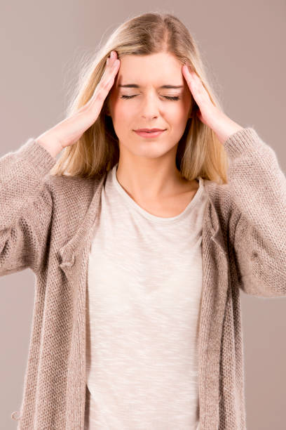 istock Woman with headache 1189545122
