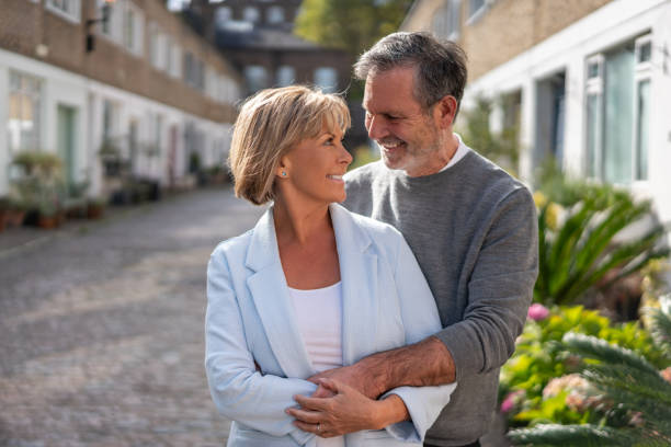 istock Affectionate couple hugging in the street 1189546950
