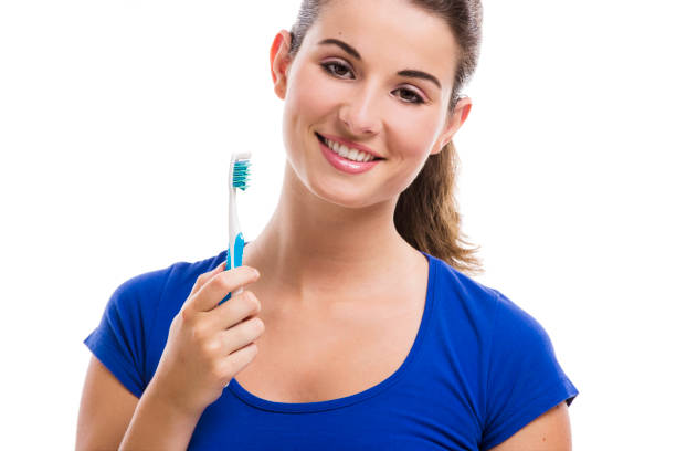 istock Beautiful woman with a toothbrush 1189549285