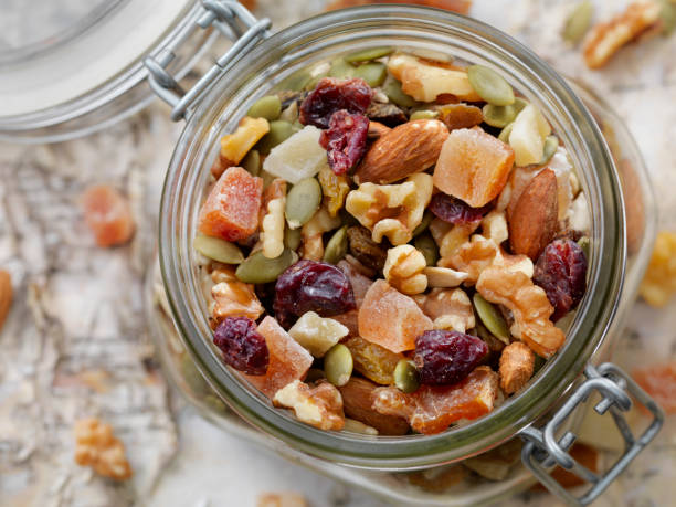 jar of trail mix - nut spice peanut almond foto e immagini stock