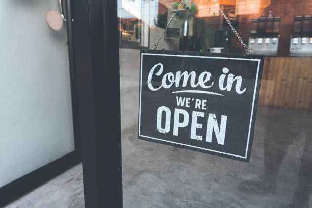 istock Welcome open sign on door .vintage tone. 1189550396
