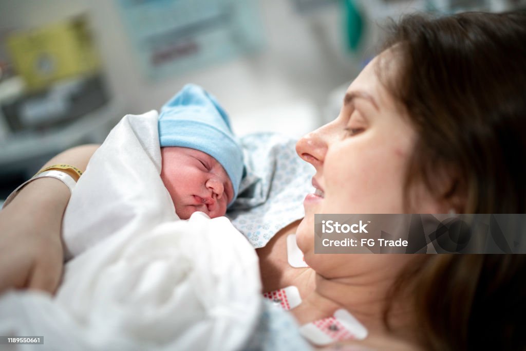 Mother looking at her baby for the first time Caesarean Section Stock Photo