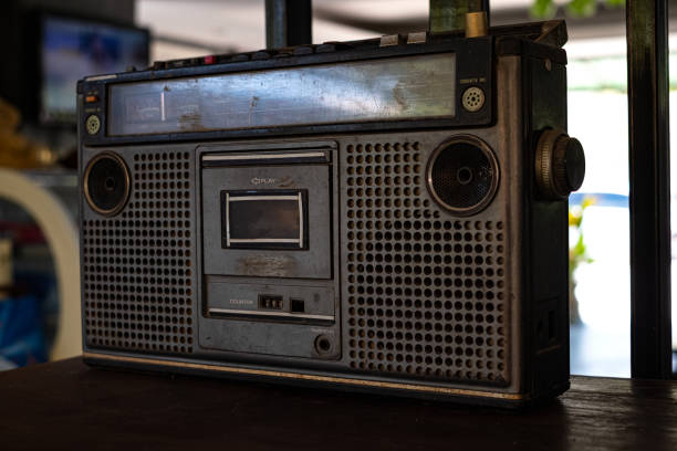 istock Old fashioned audio tape player on top desk wood background 1189551802
