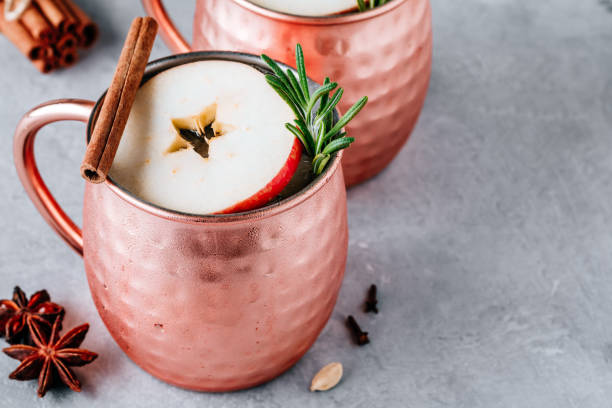 istock Apple Cider Moscow Mule cocktail with cinnamon stick and rosemary in copper 1189551878
