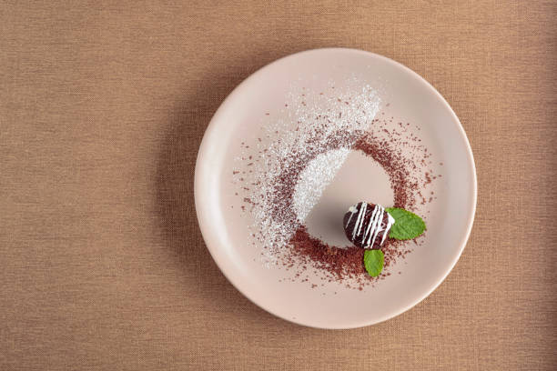istock Chocolate ball with mint on a beige plate. 1189551897