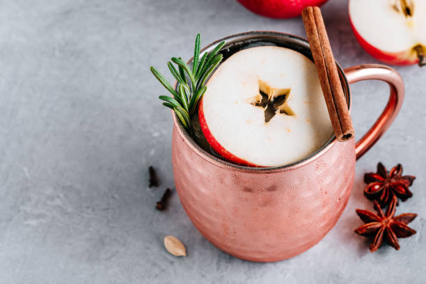 istock Apple Cider Moscow Mule cocktail with cinnamon stick and rosemary in copper 1189551898