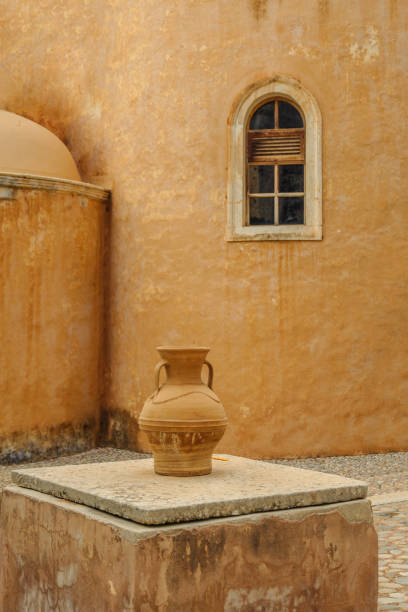 istock Amphora on the background of the monastery window 1189552060