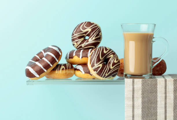 istock Chocolate donuts and latte on a black background. 1189554734