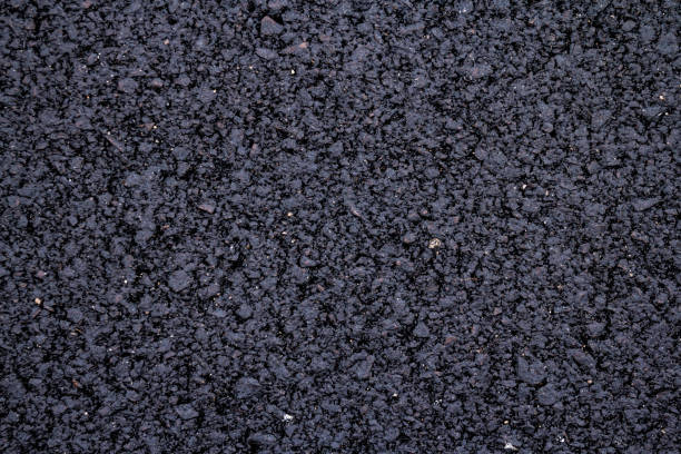 istock close up of new asphalt road texture 1189556771