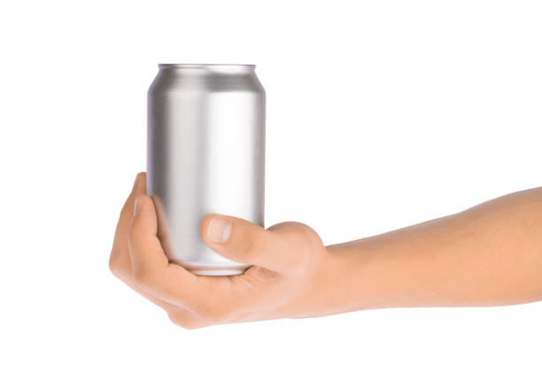 istock Hand holds metal beverage drink can isolated on white 1189557852