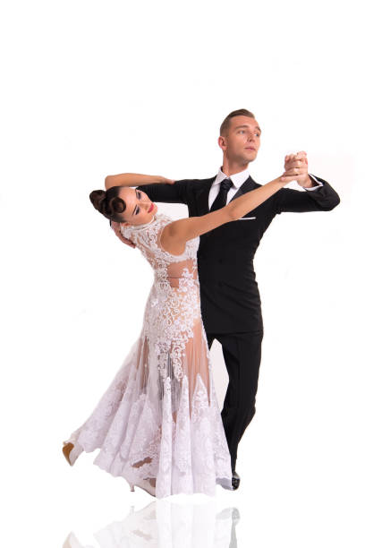 istock ballrom dance couple in a dance pose isolated on white bachground 1189558571