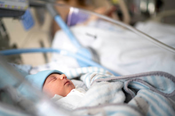 istock Newborn sleeping at hospital 1189558982