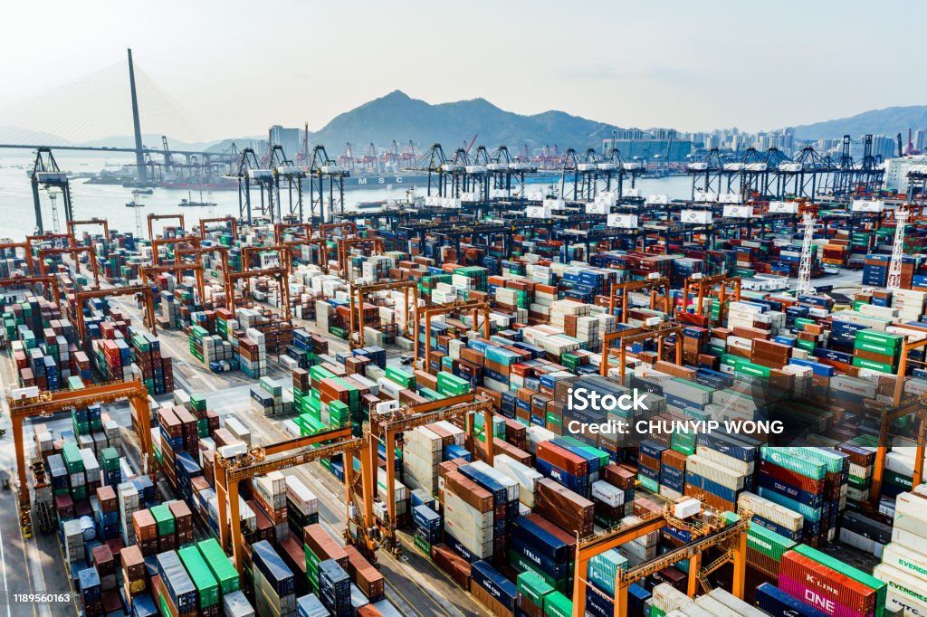 Aerial view of colorful container terminal Shipping cargo commercial logistics industry Aerial view of huge industrial port with containers. Global trade networks Trade War Stock Photo