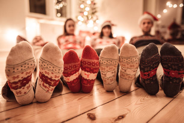 istock friends lying down at home for christmas 1189562570