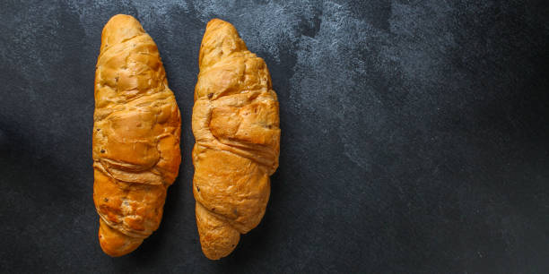 istock croissant (delicious fresh pastries, sandwich roll) menu concept. food background. top view. copy space 1189562900