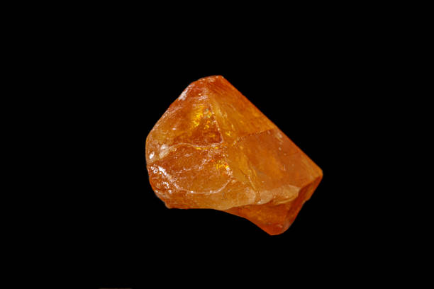 istock macro mineral stone Scheelite on a black background 1189565670