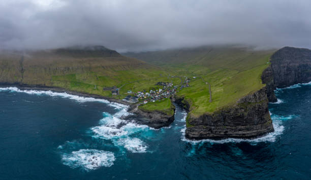 Natural harbour gorge in Gjogv village aerial view Natural harbour gorge in Gjogv village aerial view, Faroe islands eysturoy stock pictures, royalty-free photos & images