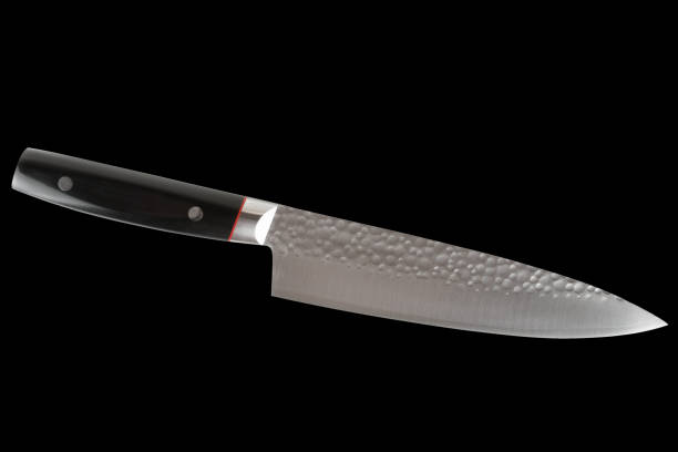 istock Brand new Japanese kitchen knife isolated on black 1189566564