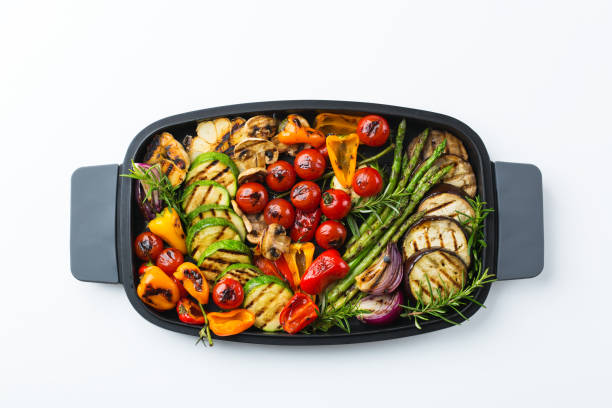 istock Grilled vegetables in a pan on a white 1189566913