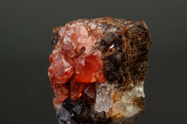 istock macro mineral stone Rhodochrosite on a black background 1189566942