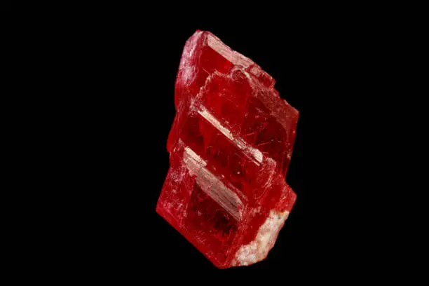 macro mineral stone Rhodochrosite on a black background close-up