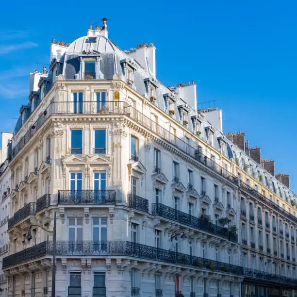 Paris, parisian facade in a chic area, typical balcony and windows rue Montmartre