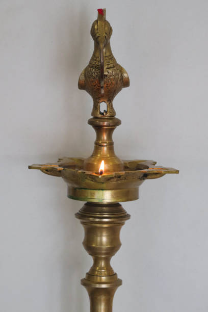 istock Indian Common Brass Diya Lamp Glowing Centered 1189570375