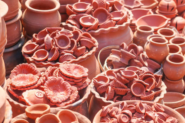 istock Bunch Group or Stack of Hand Made Earthen Lamps and Potteries for Deepawali Diwali 1189570628