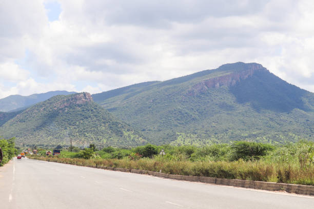 istock Natural Greenery Clouds Hills and Highway Road India 1189570633