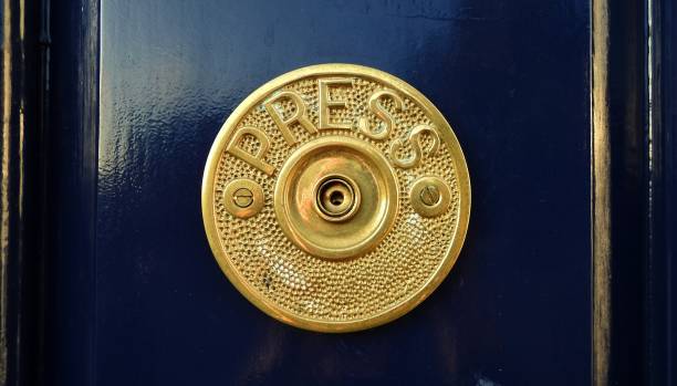 Door bell Press message on circular brass door bell. doorbell photos stock pictures, royalty-free photos & images