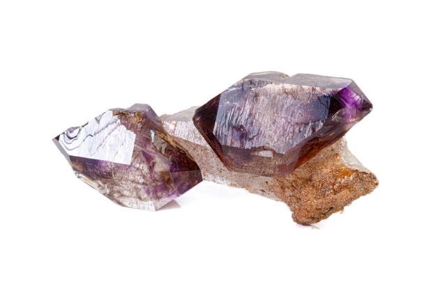 istock macro mineral stone Amethyst on smoky quartz on a white background 1189571605
