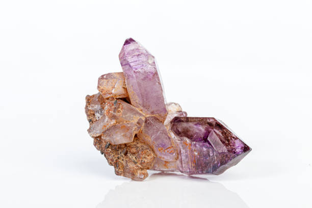 istock macro mineral stone Amethyst on smoky quartz on a white background 1189571688