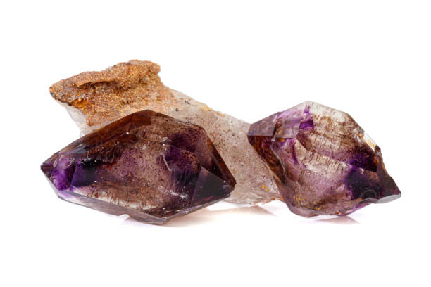 istock macro mineral stone Amethyst on smoky quartz on a white background 1189571782