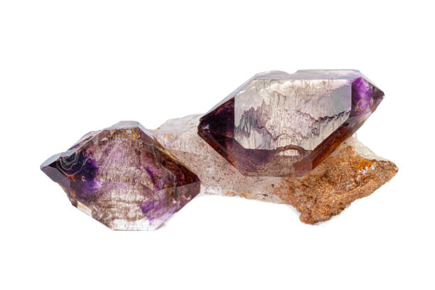istock macro mineral stone Amethyst on smoky quartz on a white background 1189571989
