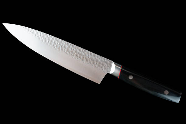 istock Brand new Japanese kitchen knife isolated on black 1189572173