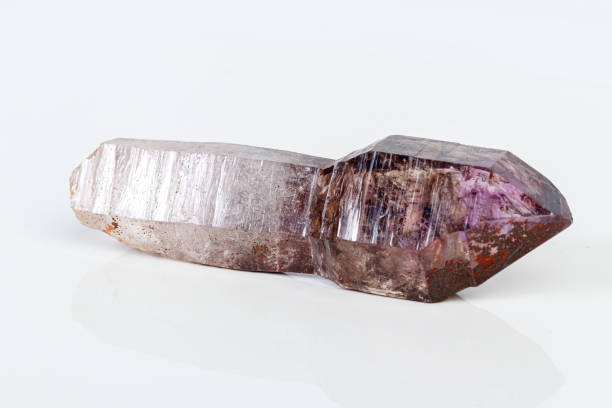 istock macro mineral stone Amethyst on smoky quartz on a white background 1189572251