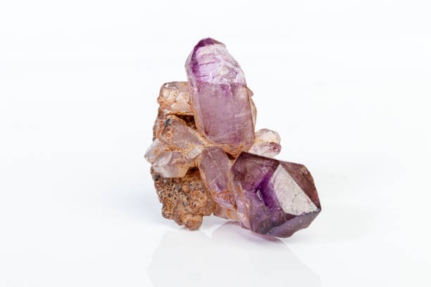 istock macro mineral stone Amethyst on smoky quartz on a white background 1189573028