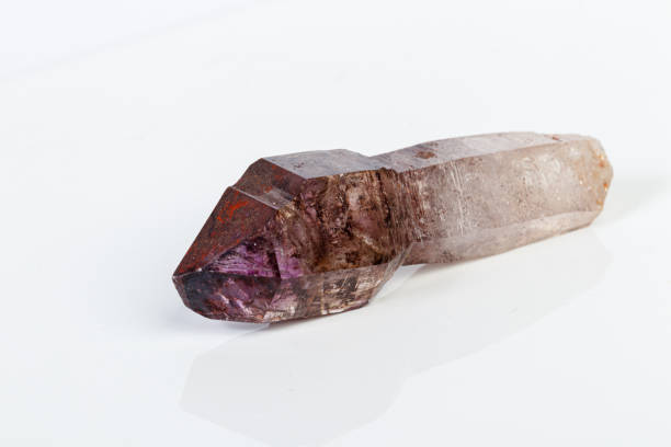 istock macro mineral stone Amethyst on smoky quartz on a white background 1189573048