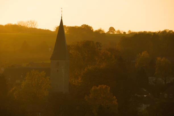 Village church in the morning sunlight on at the beginning of an autumn day