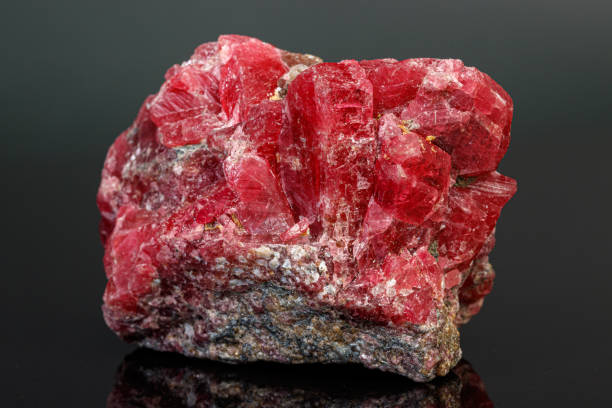 istock macro mineral stone Rhodochrosite on a black background 1189573454