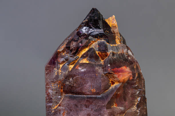 istock macro mineral stone  amethyst with smoky quartz on a black background 1189574164