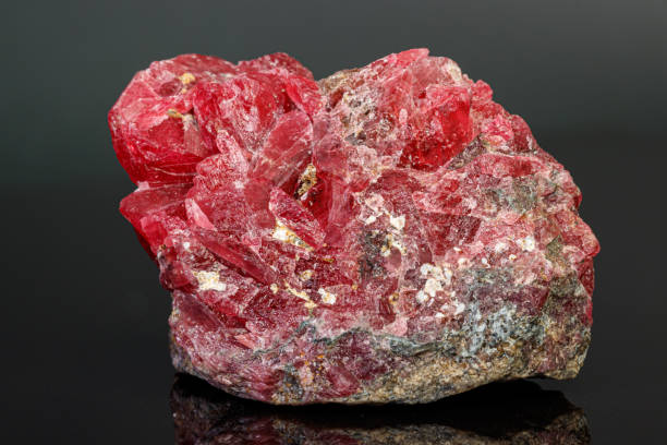 istock macro mineral stone Rhodochrosite on a black background 1189574171