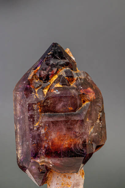 istock macro mineral stone  amethyst with smoky quartz on a black background 1189574236