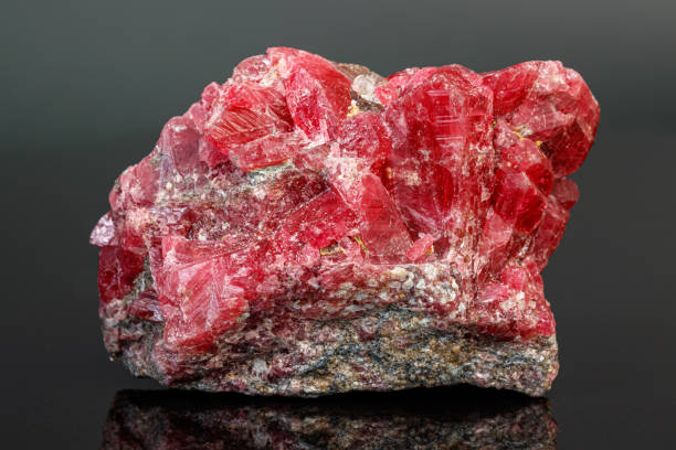istock macro mineral stone Rhodochrosite on a black background 1189574331